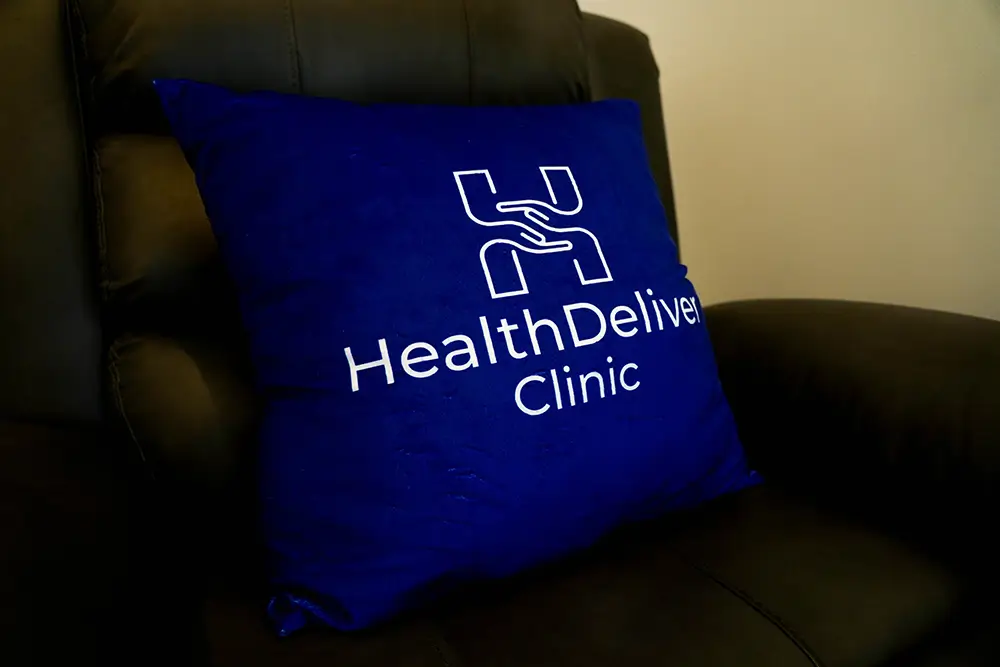 Finding a Family Doctor Asoke, Bangkok 3 Family Doctor Asoke
Chair with a blue cushion on it with the logo of healthdeliver